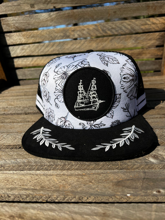 BLACK AND WHITE FLORAL FOAM TRUCKER